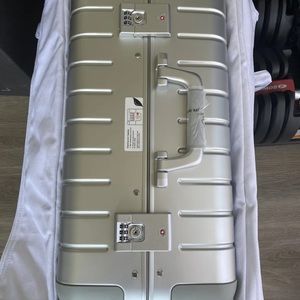 AWAY the Bigger Carry On silver aluminum spinner wheeled suitcase